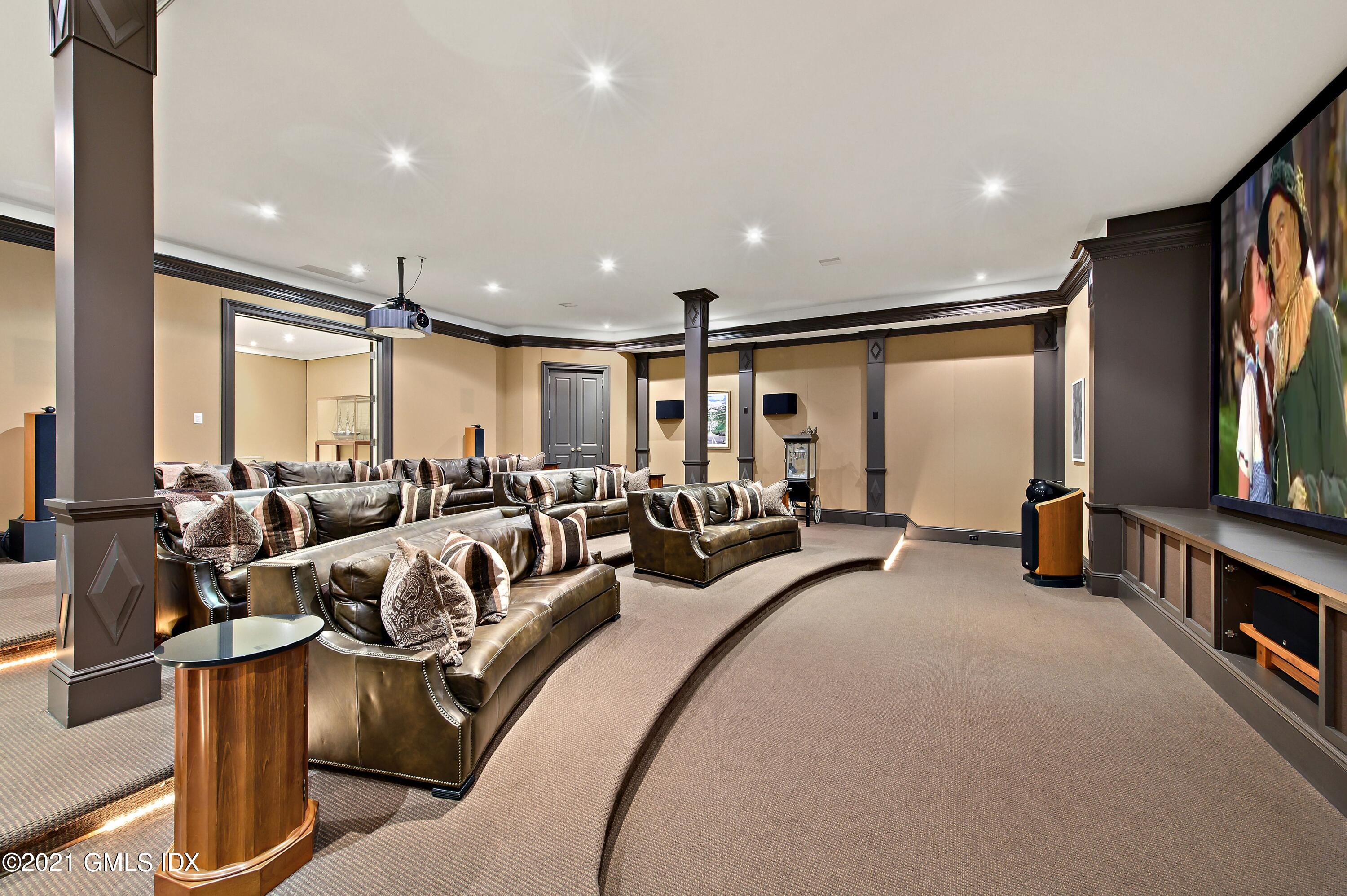 435 Round Hill Road Greenwich, CT 06831 - Photo 26 of 44 a very nice looking living room with a large window and a flat screen tv