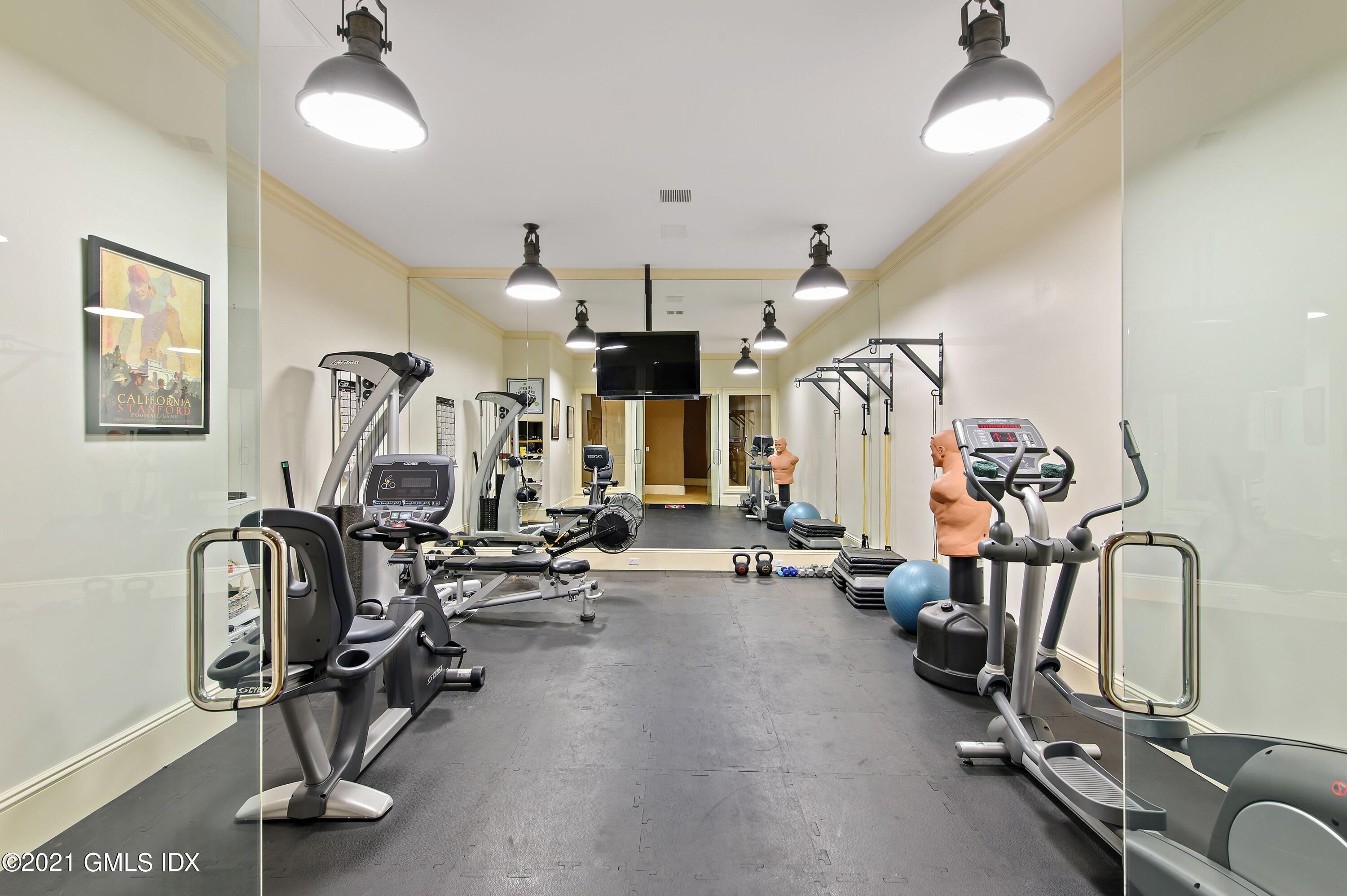 435 Round Hill Road Greenwich, CT 06831 - Photo 30 of 44 a view of a room with gym equipment