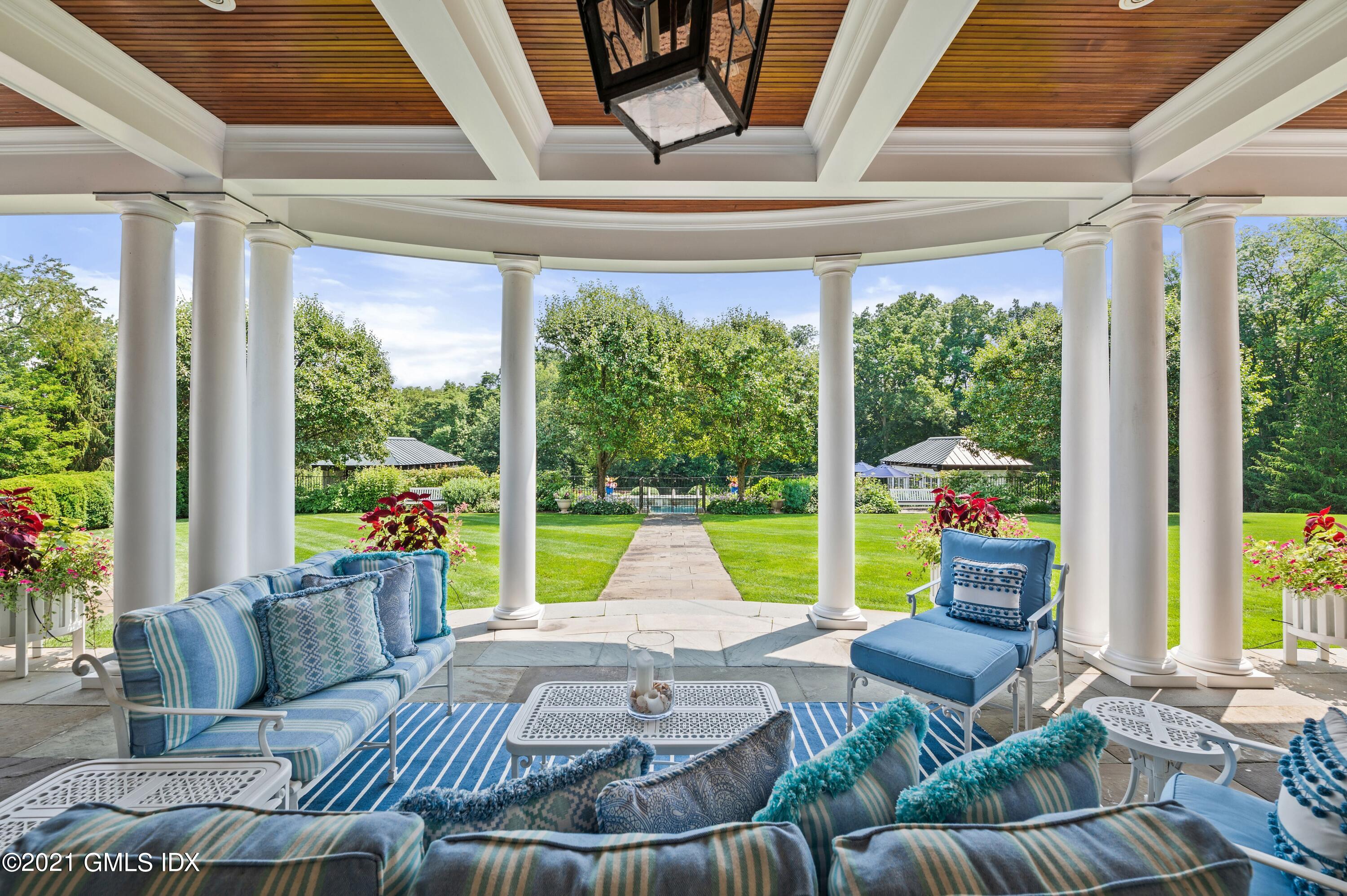 435 Round Hill Road Greenwich, CT 06831 - Photo 33 of 44 a living room with furniture and a large window