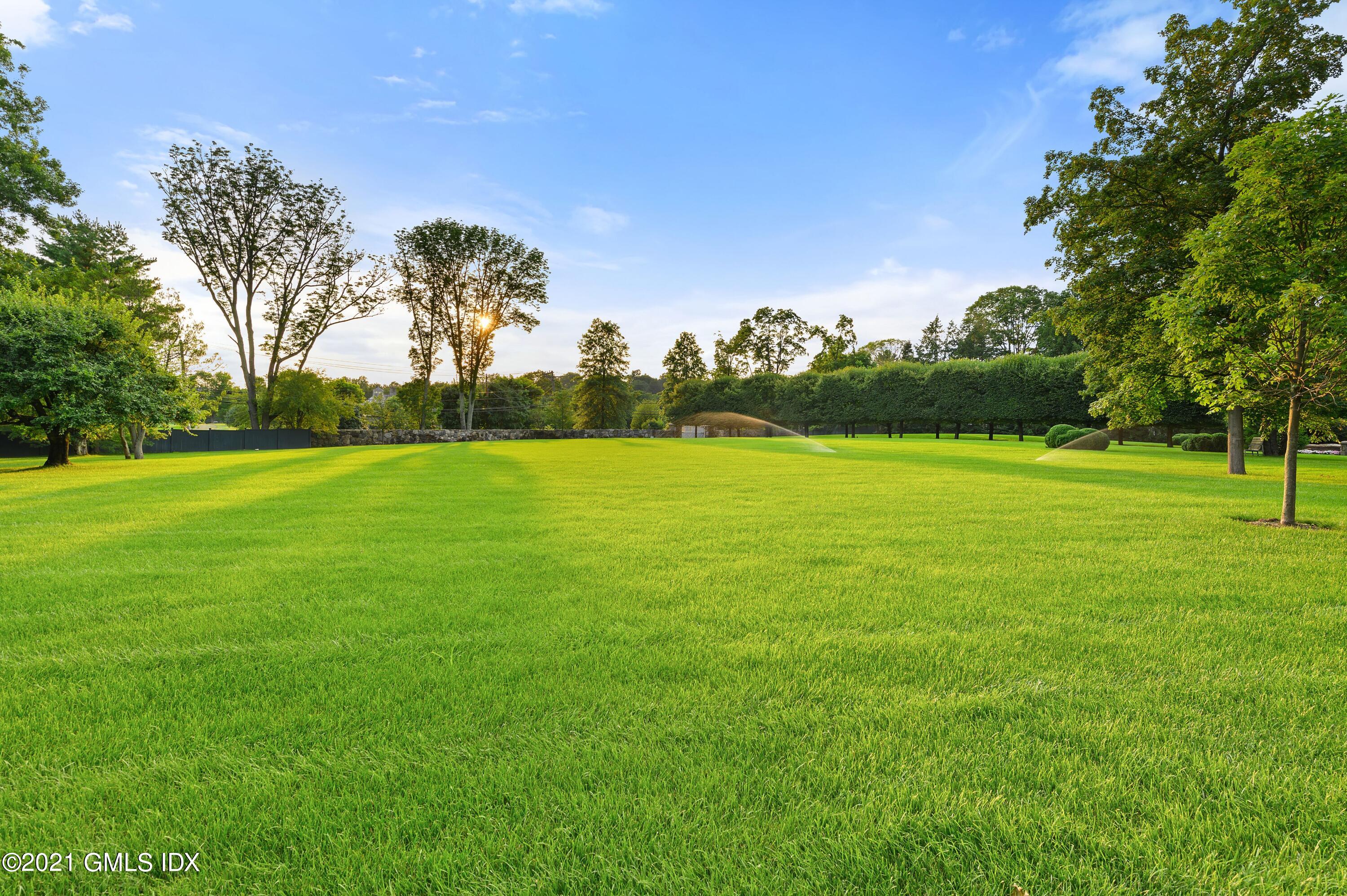 435 Round Hill Road Greenwich, CT 06831 - Photo 40 of 44 a view of a field with trees in the background