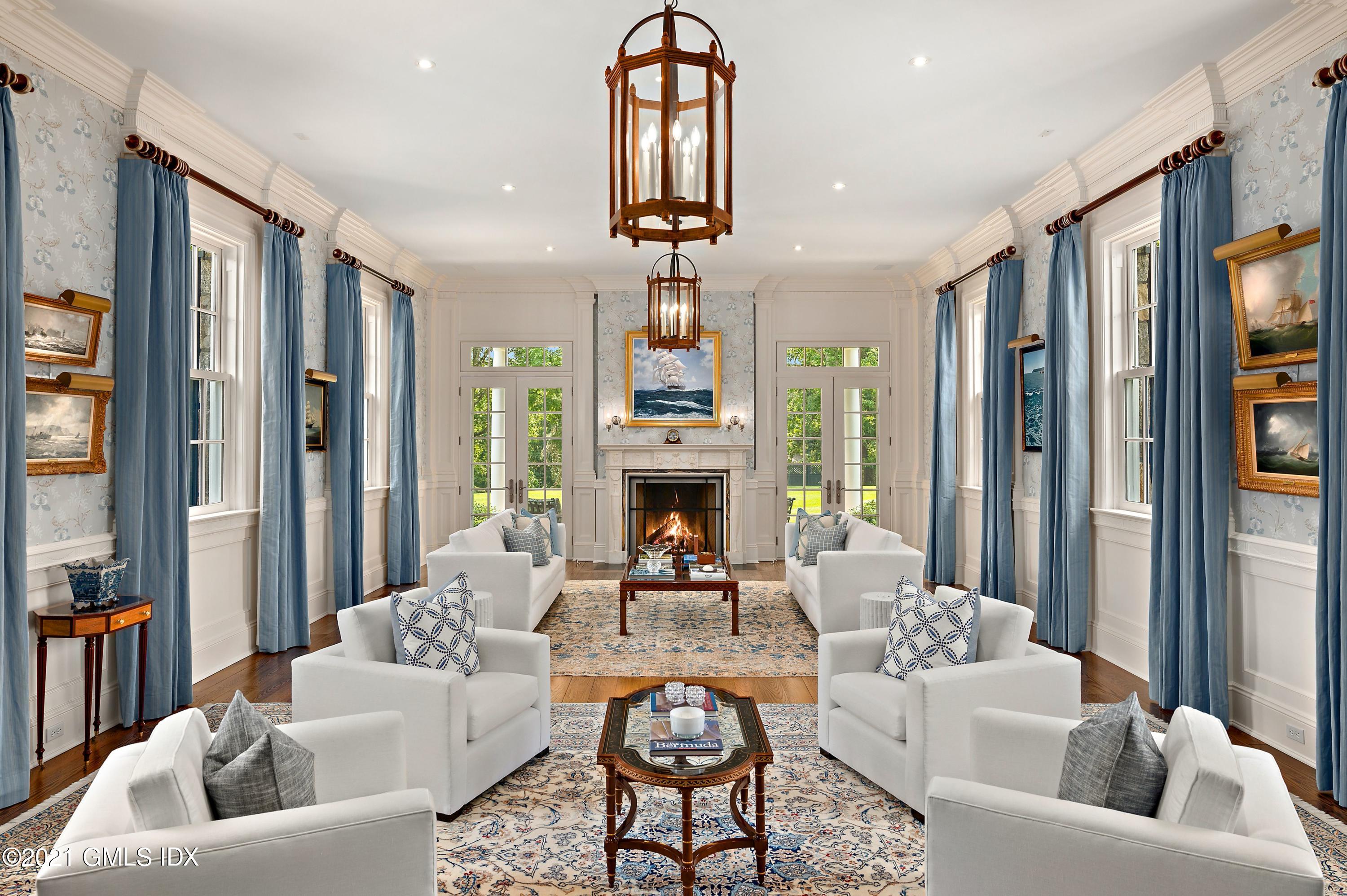 435 Round Hill Road Greenwich, CT 06831 - Photo 6 of 44 a living room with furniture fireplace and a large window