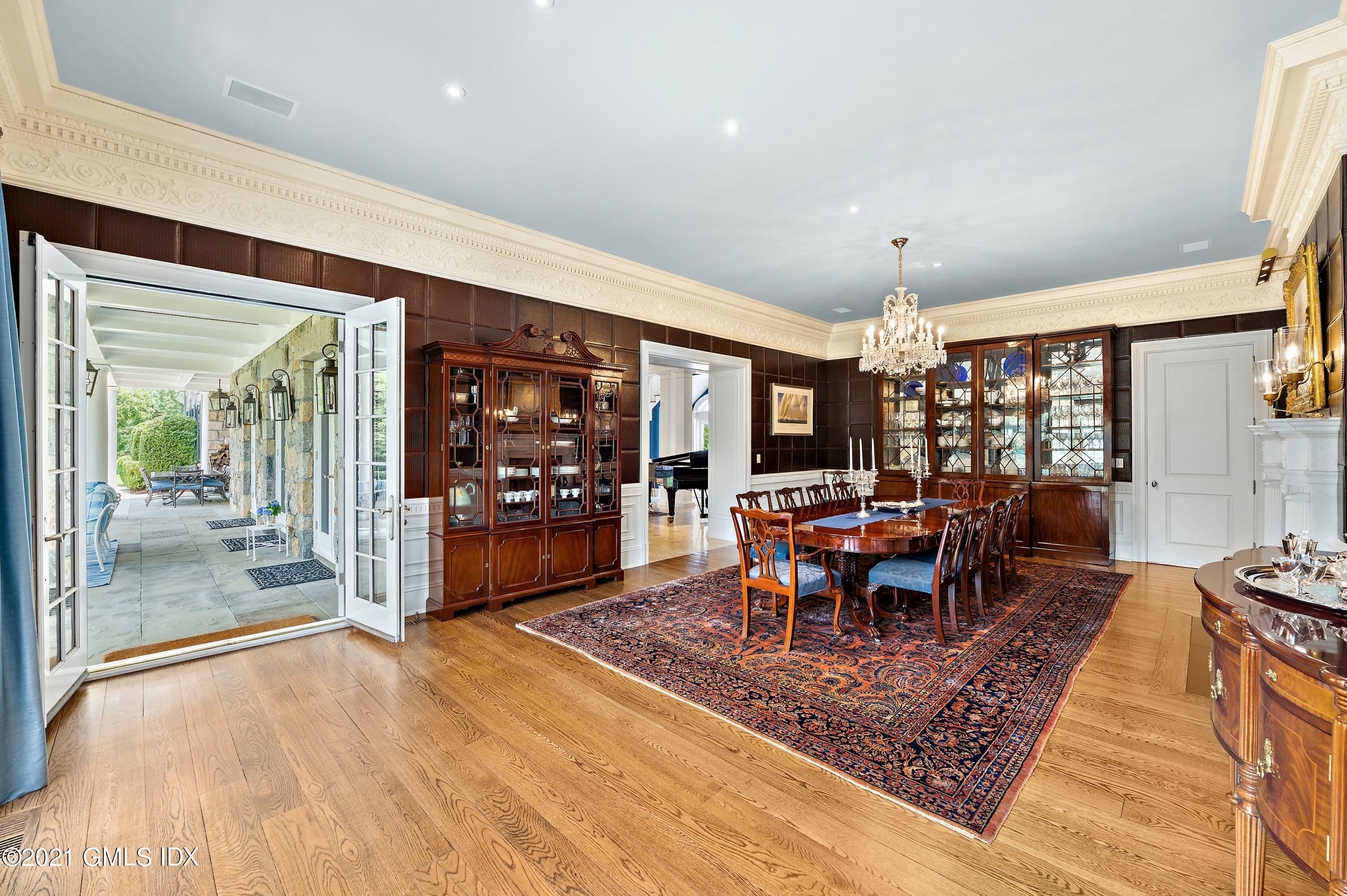 435 Round Hill Road Greenwich, CT 06831 - Photo 8 of 44 a view of a dining room with furniture window and outdoor view