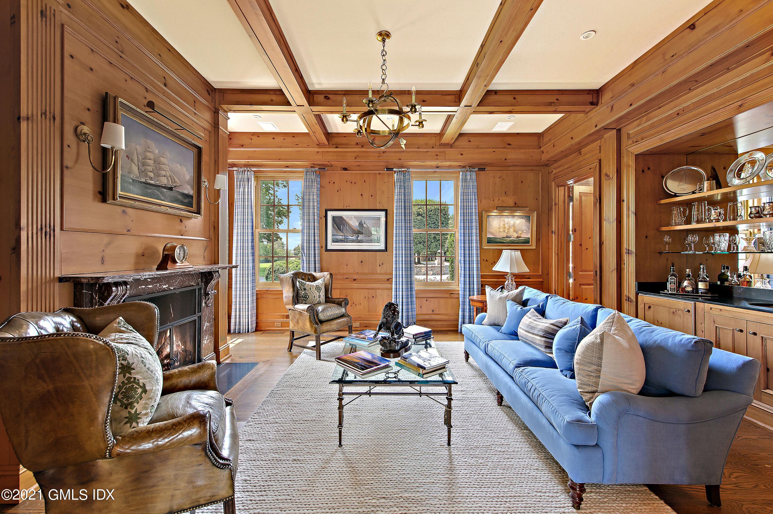 435 Round Hill Road Greenwich, CT 06831 - Photo 9 of 44 a living room with furniture and a chandelier