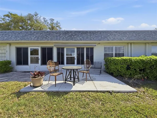 a view of a house with backyard porch and patio
