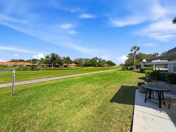 a view of a swimming pool and a yard