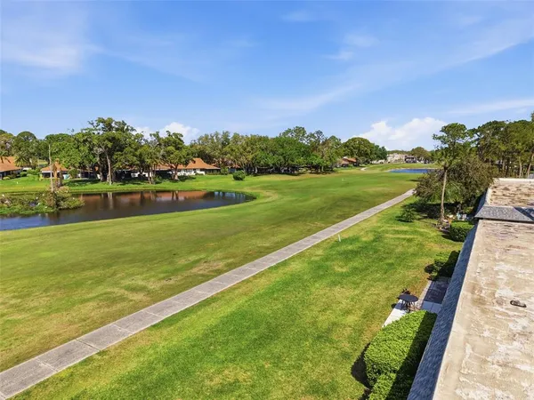 a view of a lake with houses in the background