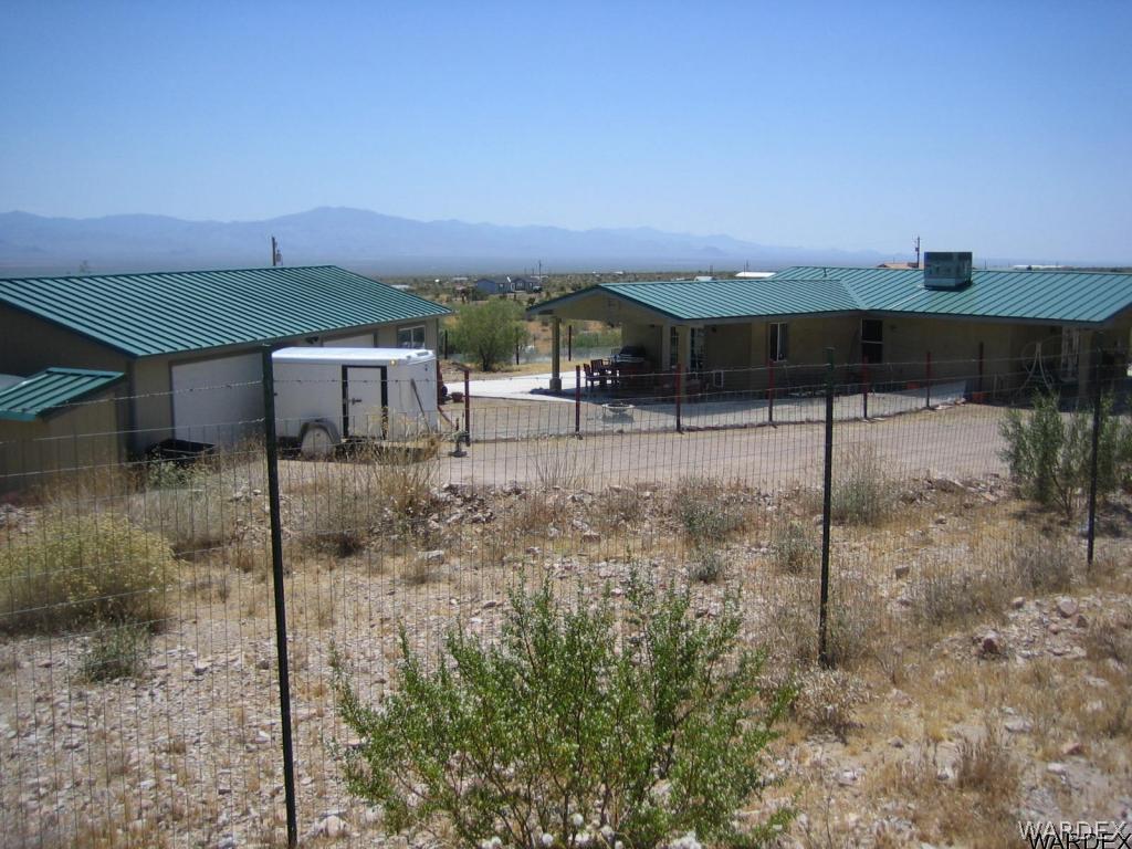 3064 Tennessee Road Golden Valley, AZ 86413 - Photo 2 of 32 a roof deck with table and chairs
