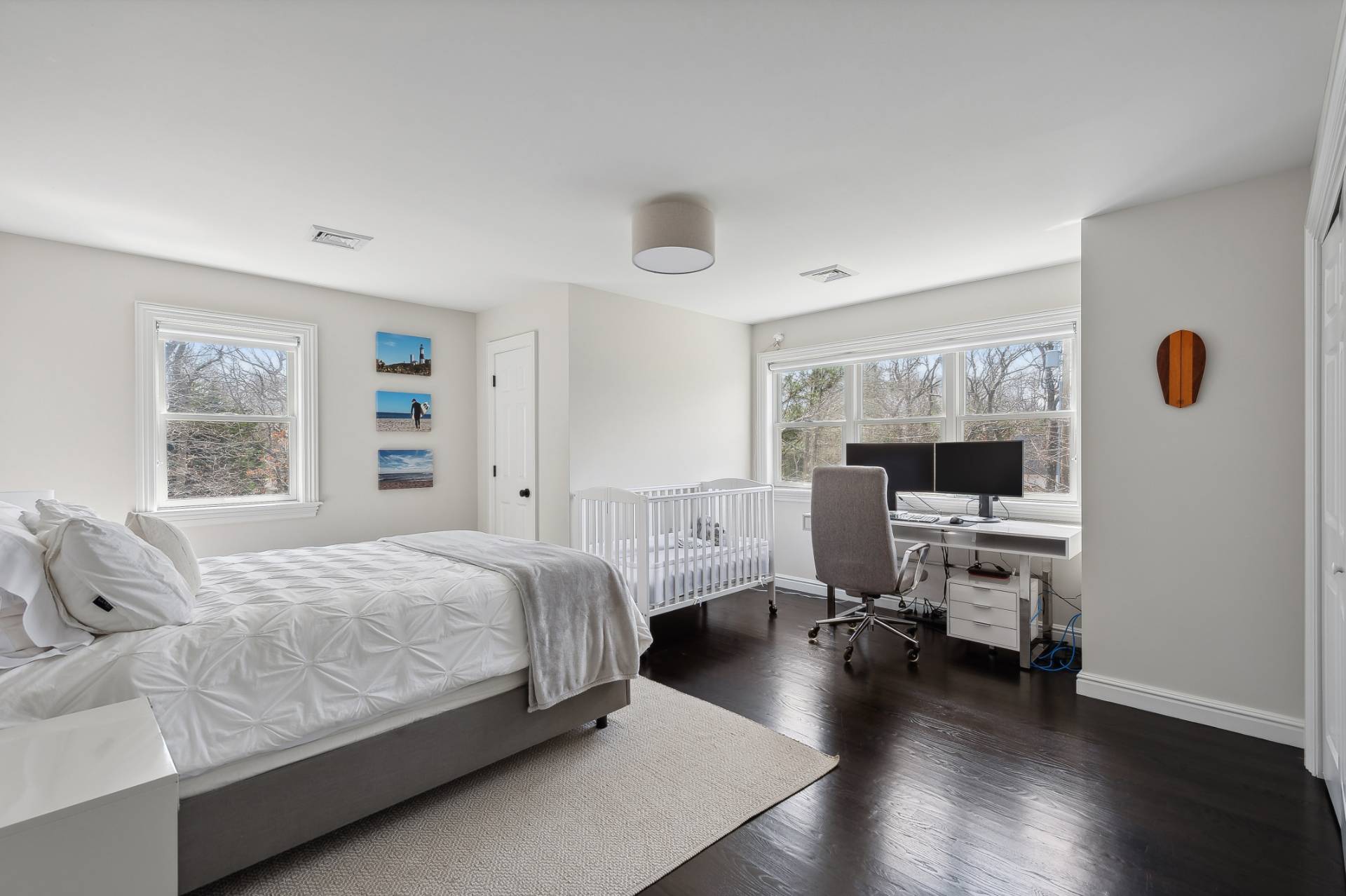 9 Central Avenue East Hampton, NY 11937 - Photo 13 of 21 a bedroom with a bed and wooden floor
