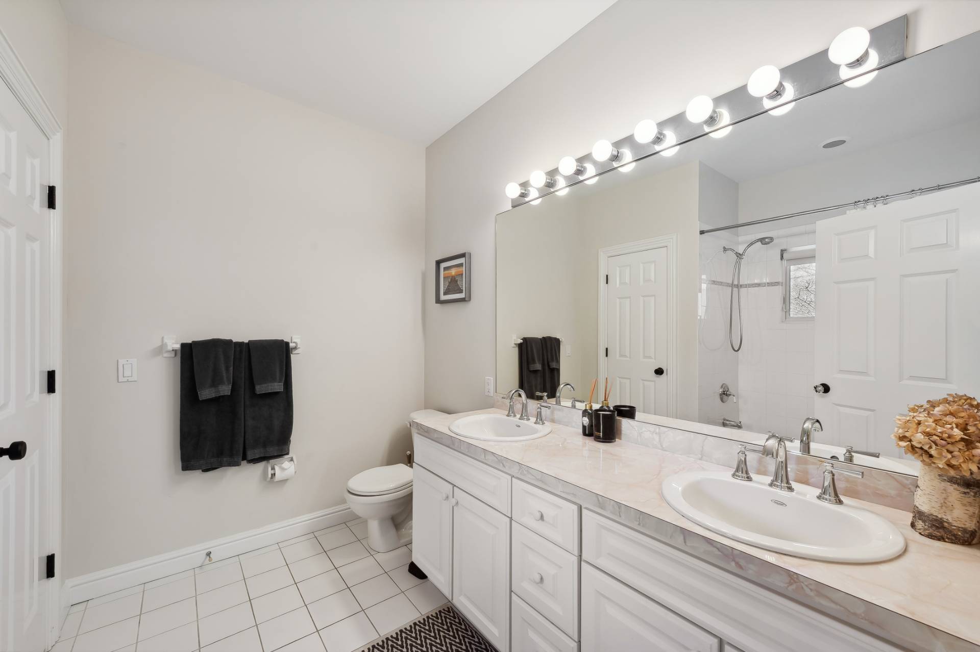 9 Central Avenue East Hampton, NY 11937 - Photo 15 of 21 a bathroom with a double vanity sink mirror and toilet