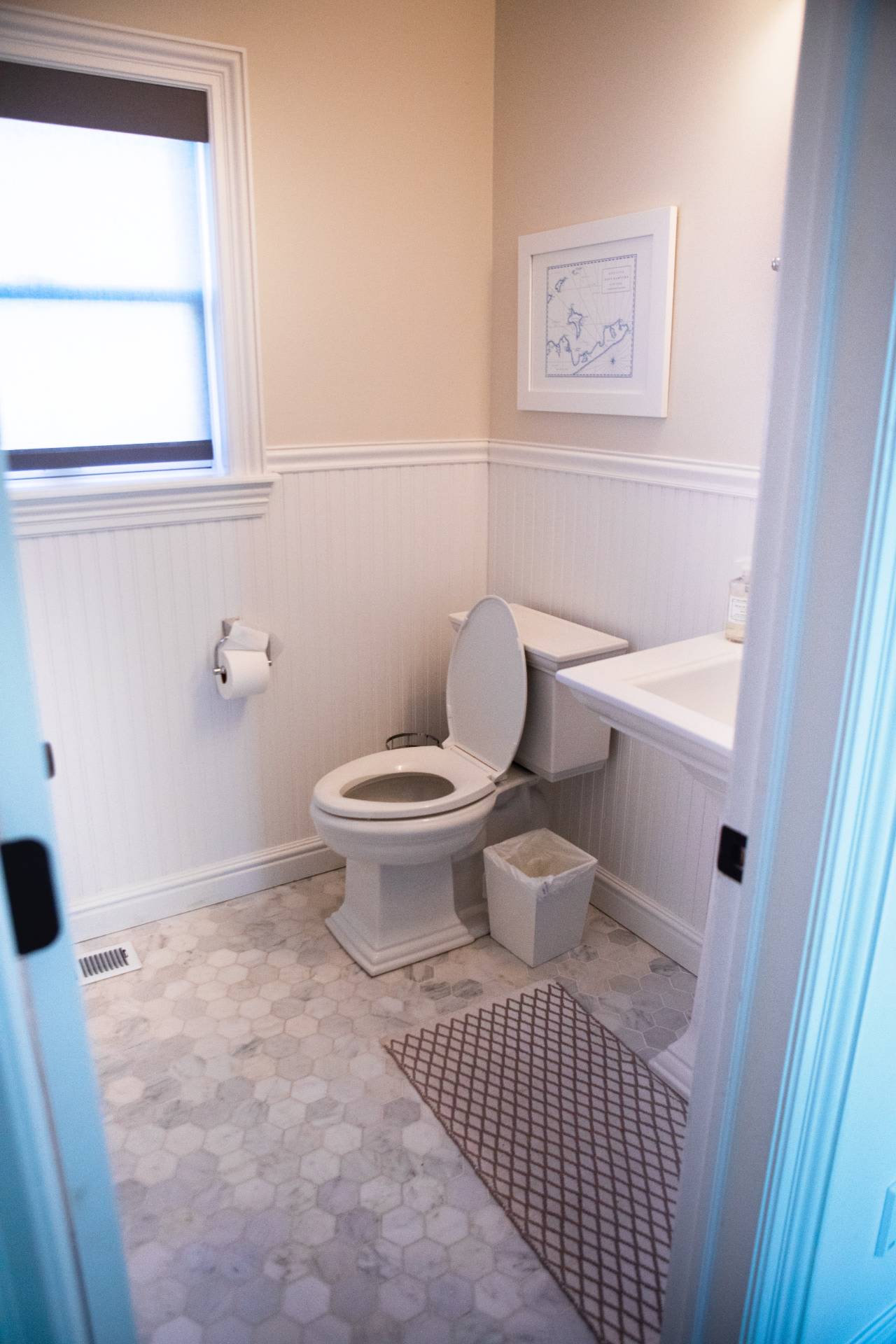 9 Central Avenue East Hampton, NY 11937 - Photo 16 of 21 a bathroom with a toilet and a shower curtain