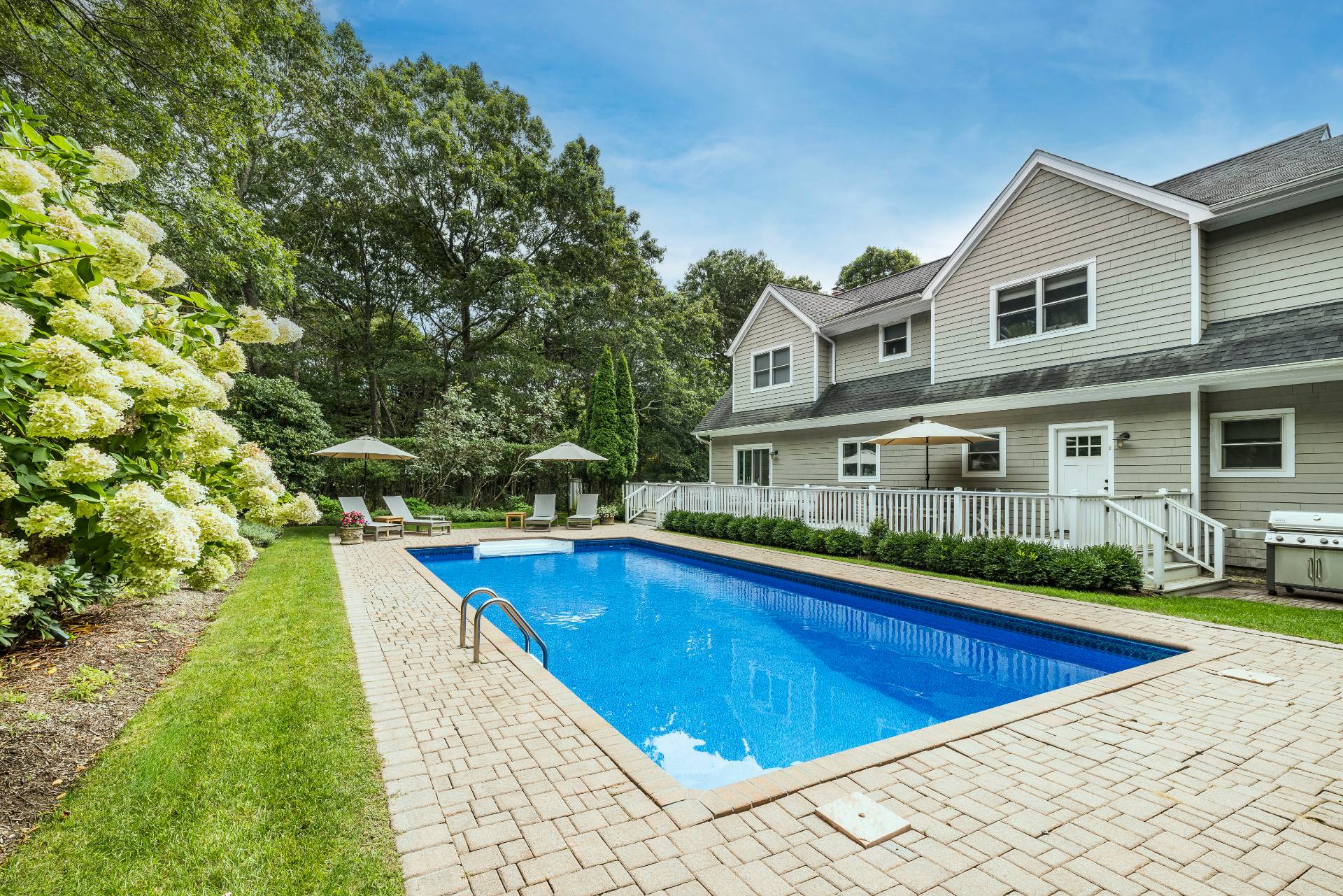 9 Central Avenue East Hampton, NY 11937 - Photo 17 of 21 a view of a house with swimming pool and yard