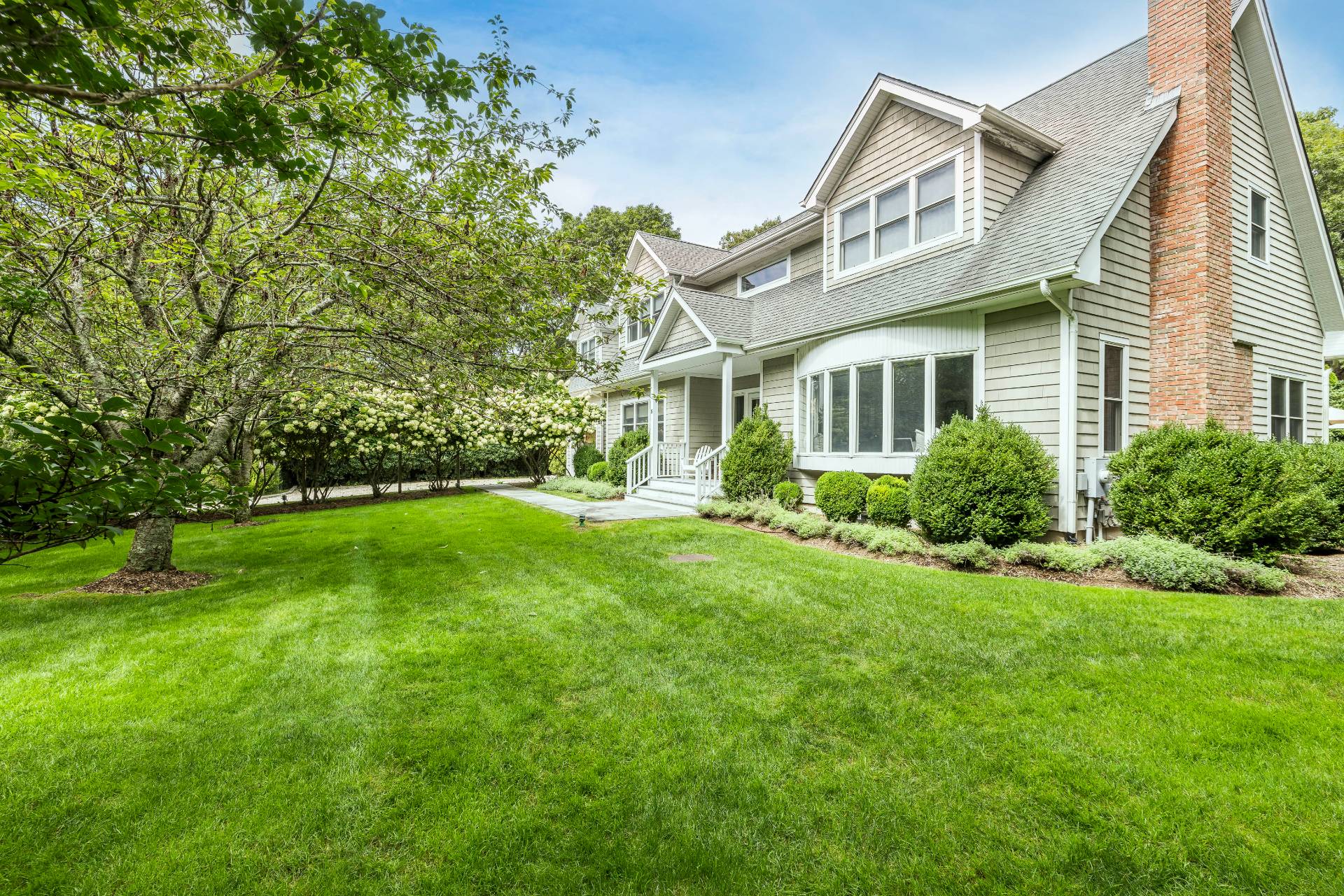 9 Central Avenue East Hampton, NY 11937 - Photo 20 of 21 a view of backyard of house with green space