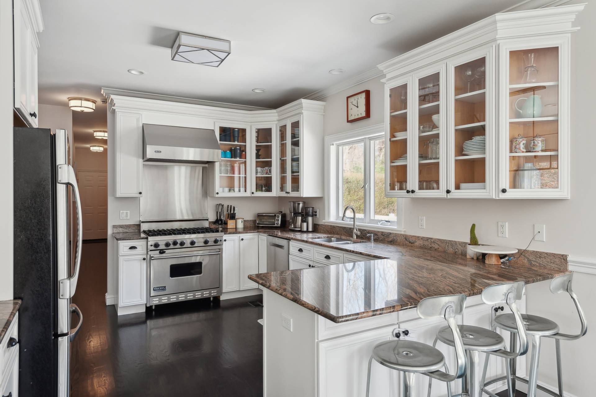 9 Central Avenue East Hampton, NY 11937 - Photo 7 of 21 a kitchen with stainless steel appliances granite countertop a stove and a sink