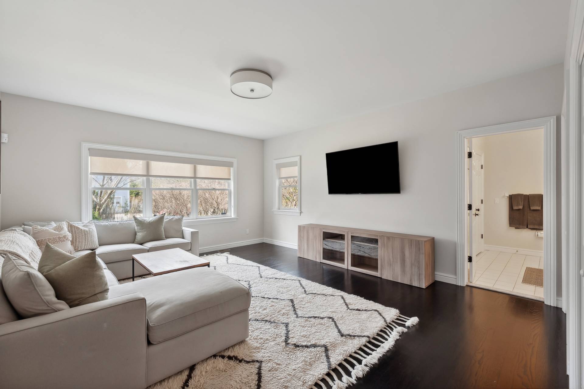 9 Central Avenue East Hampton, NY 11937 - Photo 8 of 21 a living room with furniture and a flat screen tv