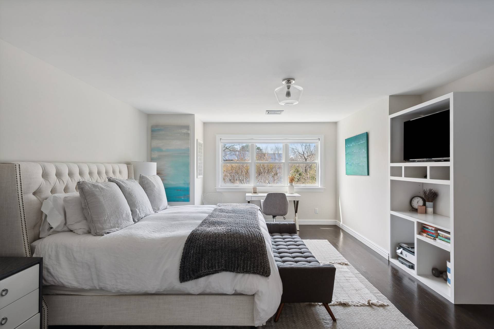 9 Central Avenue East Hampton, NY 11937 - Photo 9 of 21 a bedroom with a bed and a flat screen tv