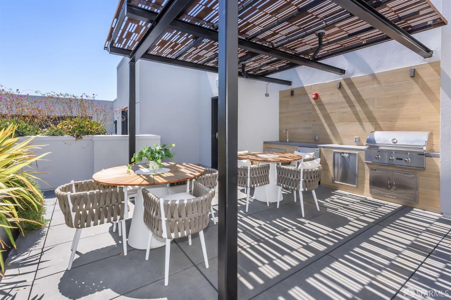 1288 Howard Street, Unit 509 San Francisco, CA 94103 - Photo 20 of 55 a view of a patio with table and chairs