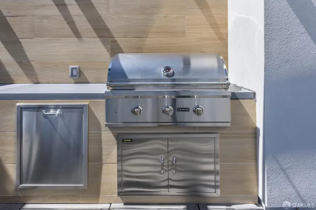a living room with gym equipment and a flat screen tv