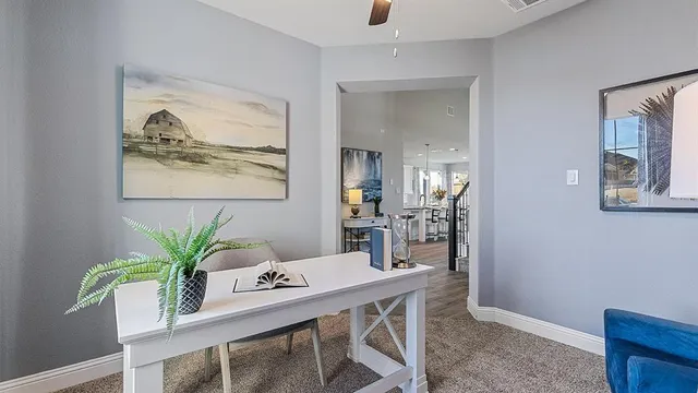 a view of a dining room with furniture a chandelier and wooden floor