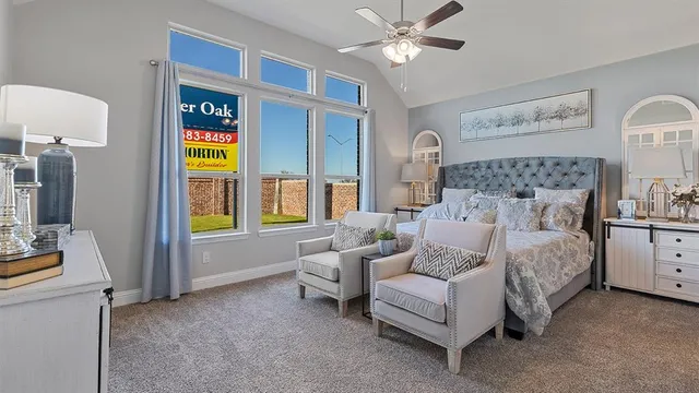 a spacious bedroom with a bed and a couch