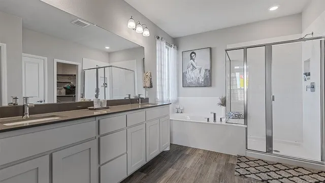 a bedroom with a bed and a lamp on table