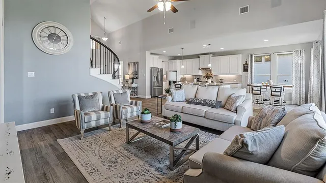 a kitchen with counter top space and wooden floor