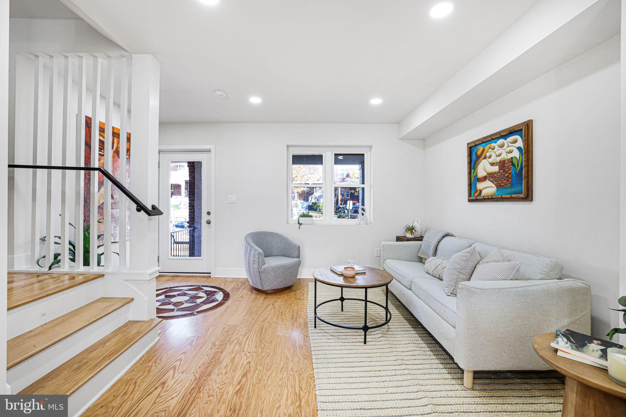2220 13th Street Northeast Washington, DC 20018 - Photo 17 of 41 a living room with furniture and a table