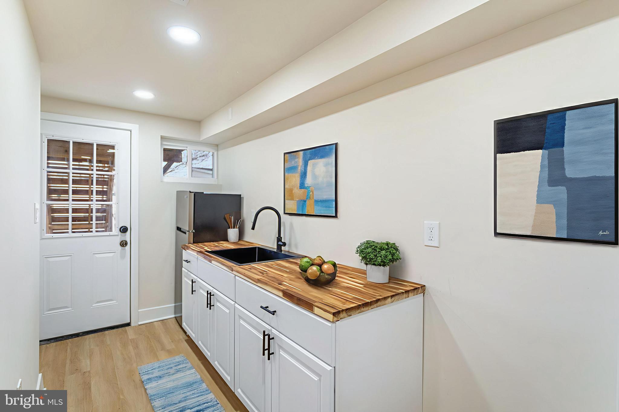 2220 13th Street Northeast Washington, DC 20018 - Photo 35 of 41 a kitchen that has a sink and a stove