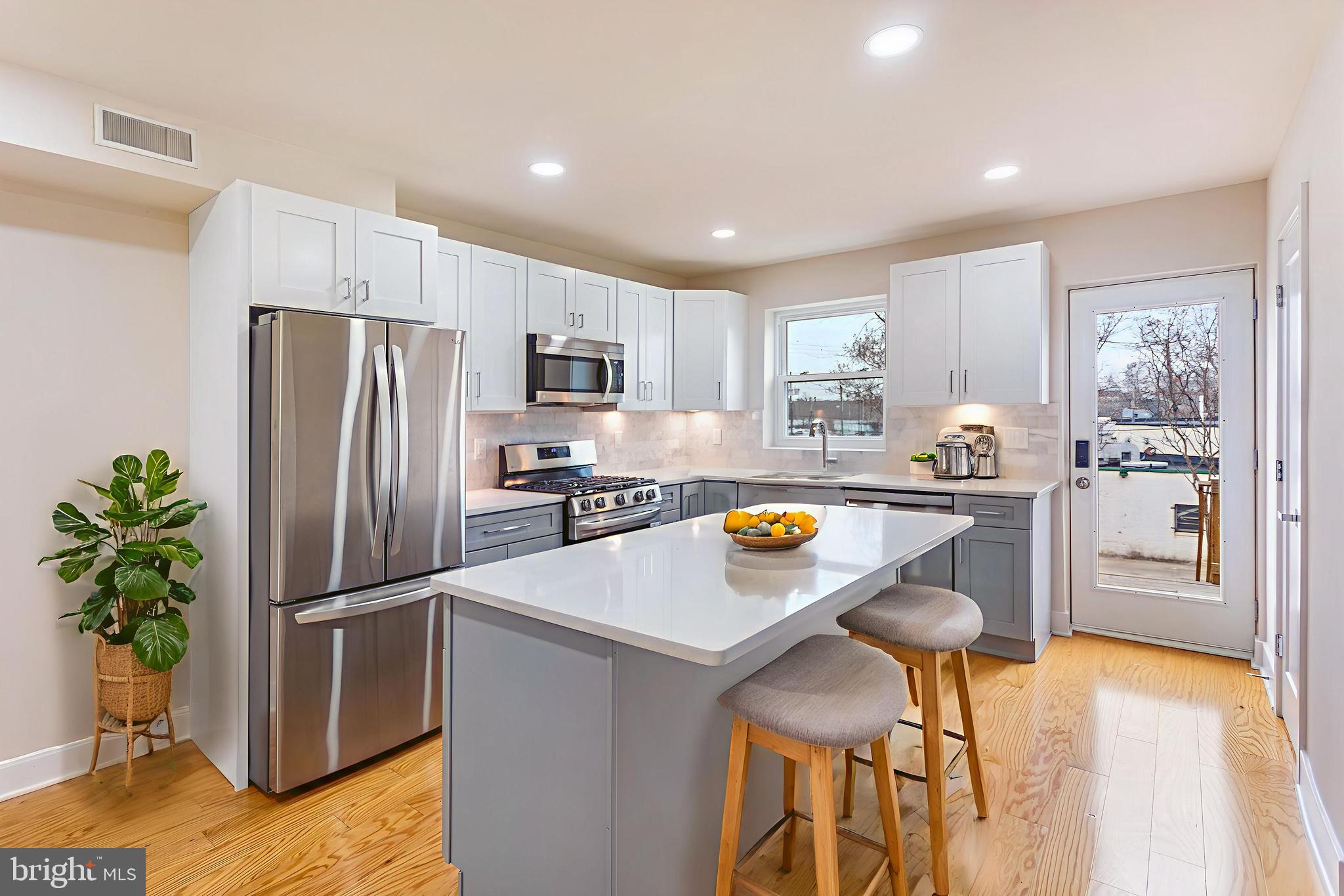 2220 13th Street Northeast Washington, DC 20018 - Photo 8 of 41 a kitchen with refrigerator and microwave