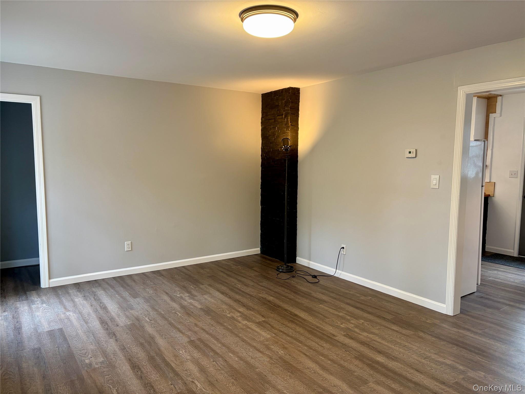44 Gregory Road Glen Spey, NY 12737 - Photo 16 of 20 an empty room with wooden floor and windows
