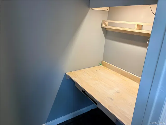 a view of house with a chairs in a patio