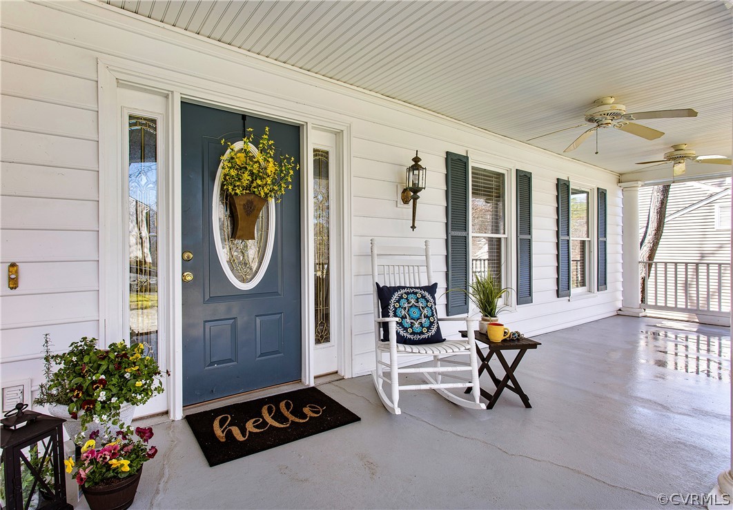 a living room with furniture a rug and a large window