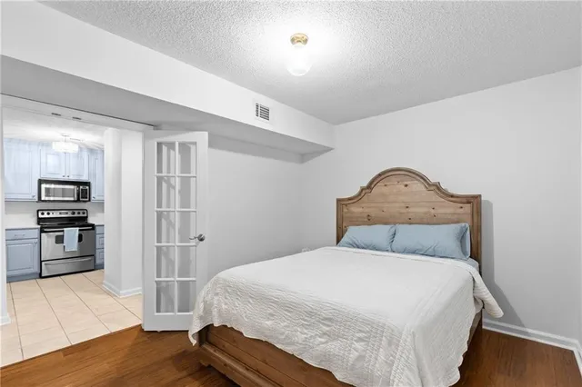 a bedroom with a bed and a view of bedroom