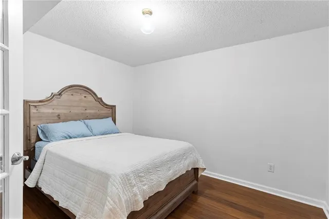 a bedroom with a bed and a closet