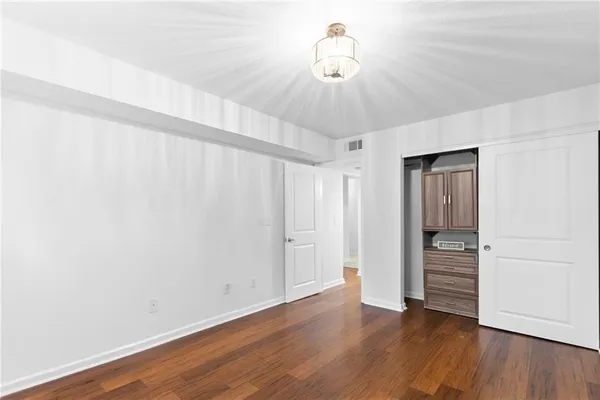a view of a livingroom with wooden floor