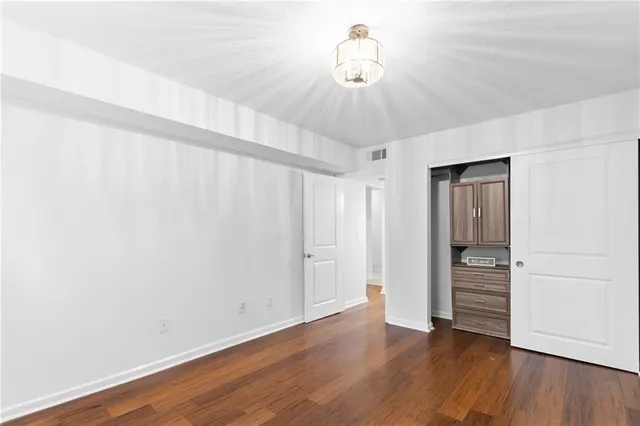 a view of a livingroom with wooden floor