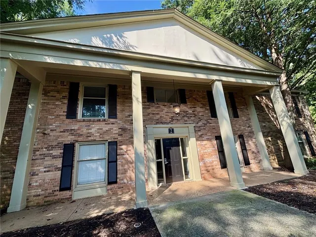 a view of a house with entrance gate