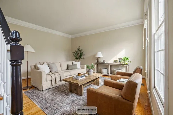 a view of a dining room with furniture window and wooden floor
