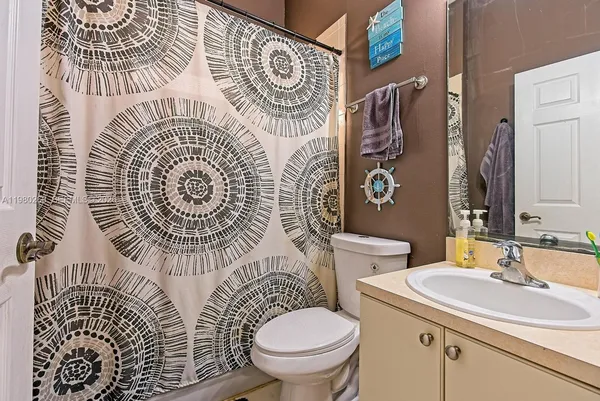 a bathroom with a toilet and a sink
