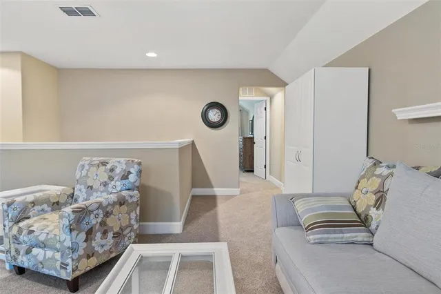 a spacious bedroom with a bed and a ceiling fan