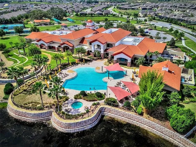 an aerial view of residential houses with outdoor space