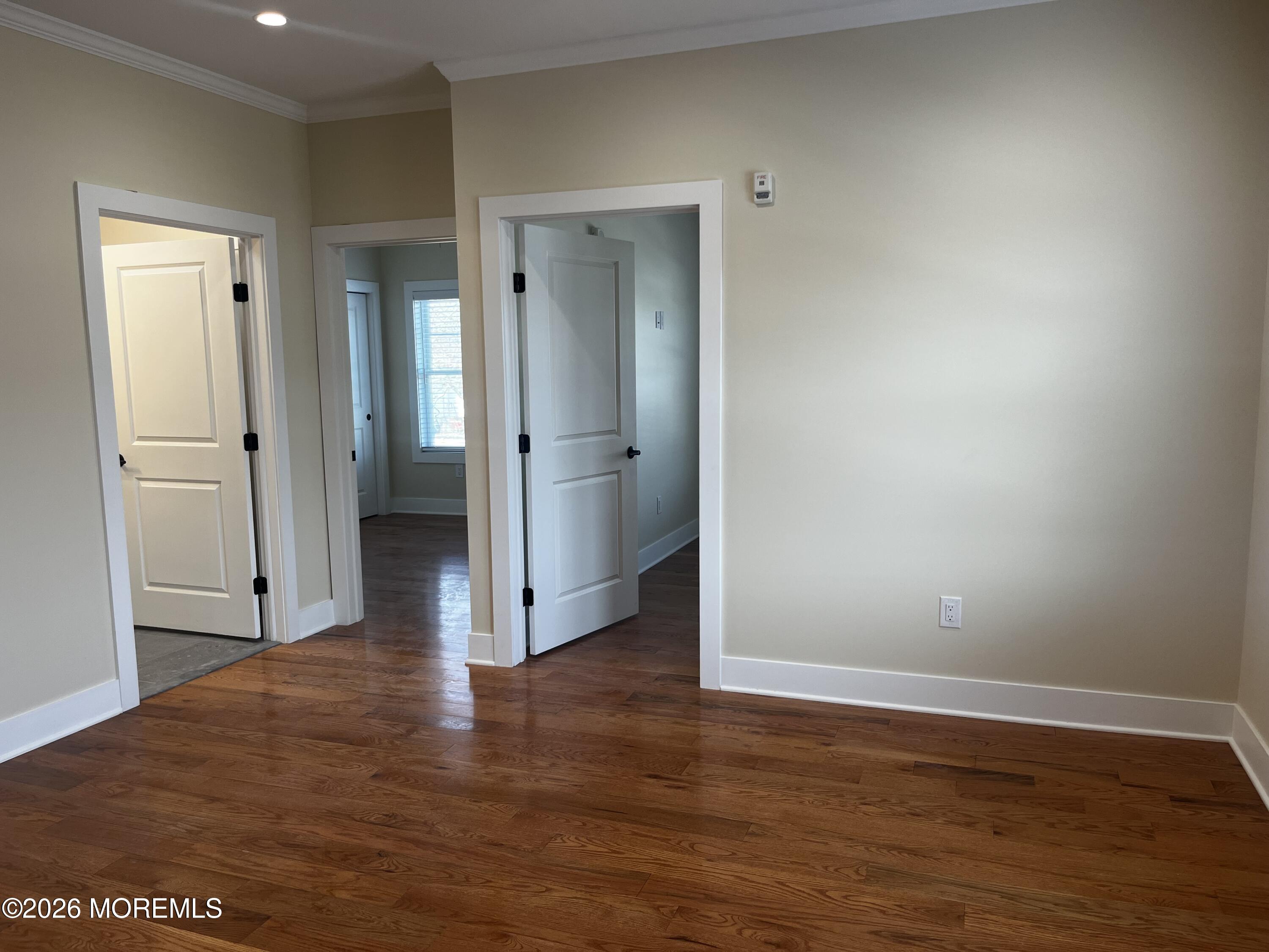 2419 Bridge Avenue, Unit 201 Point Pleasant, NJ 08742 - Photo 7 of 7 a view of a hallway with wooden floor