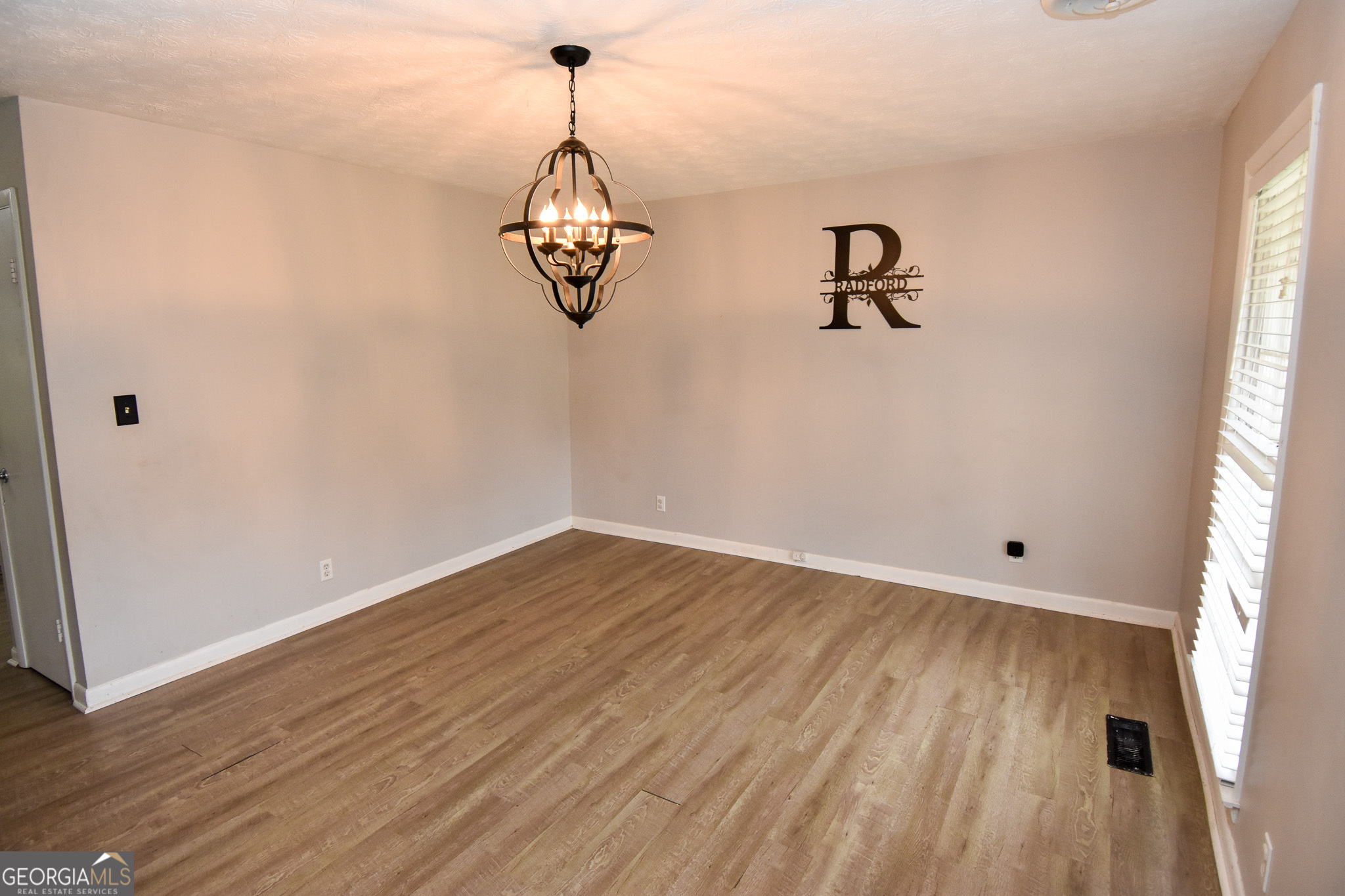 2250 Green Street Concord, GA 30206 - Photo 13 of 77 a view of empty room with wooden floor and window