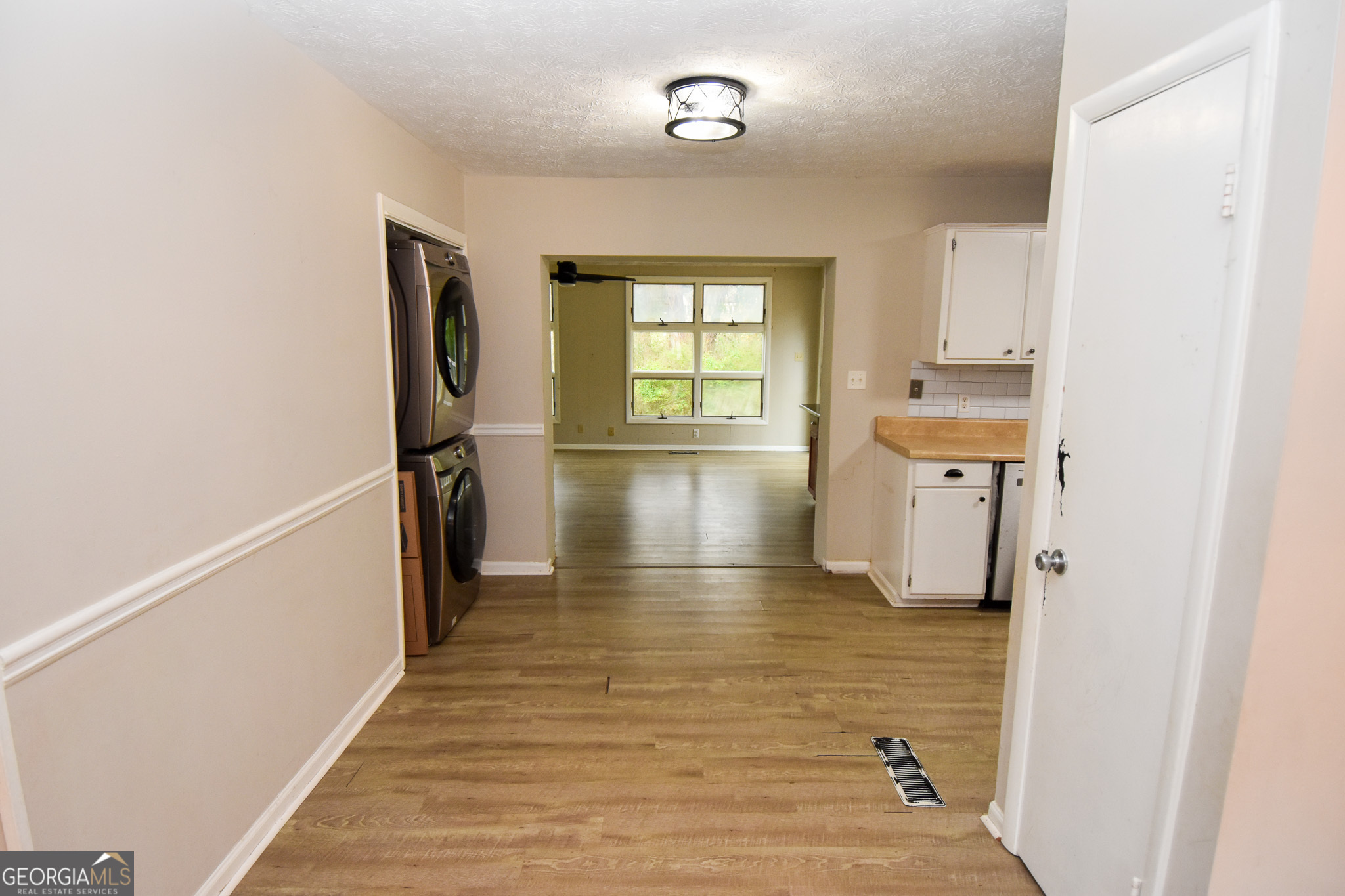 2250 Green Street Concord, GA 30206 - Photo 17 of 77 a view of a hallway with wooden floor and staircase