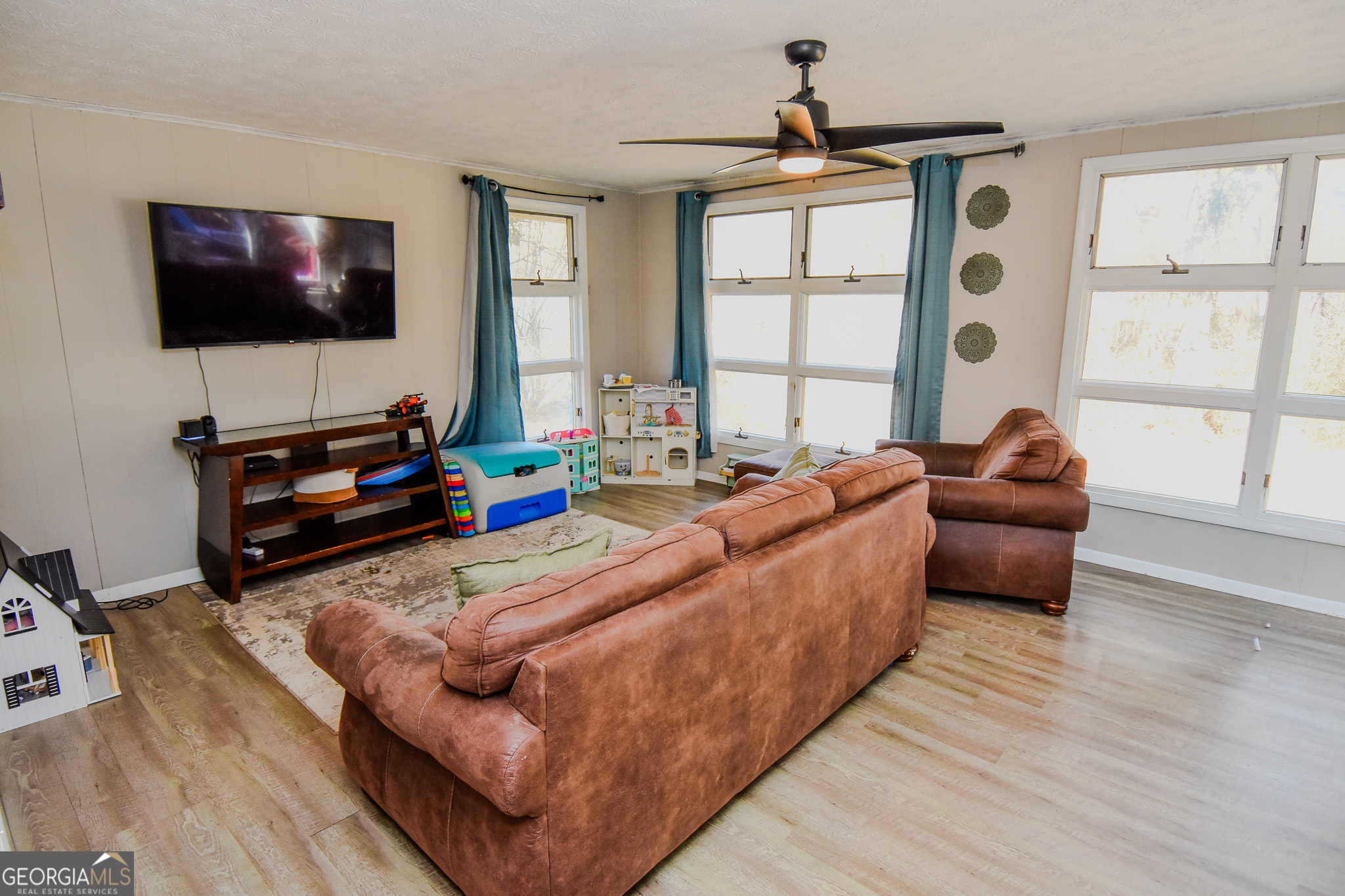 2250 Green Street Concord, GA 30206 - Photo 18 of 77 a living room with furniture and a flat screen tv