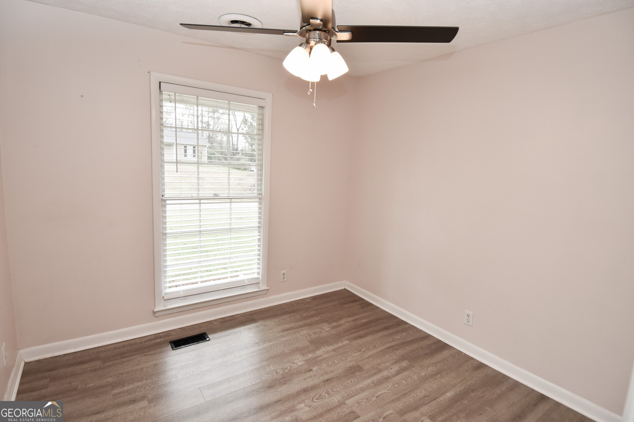 2250 Green Street Concord, GA 30206 - Photo 21 of 77 an empty room with wooden floor chandelier fan and window