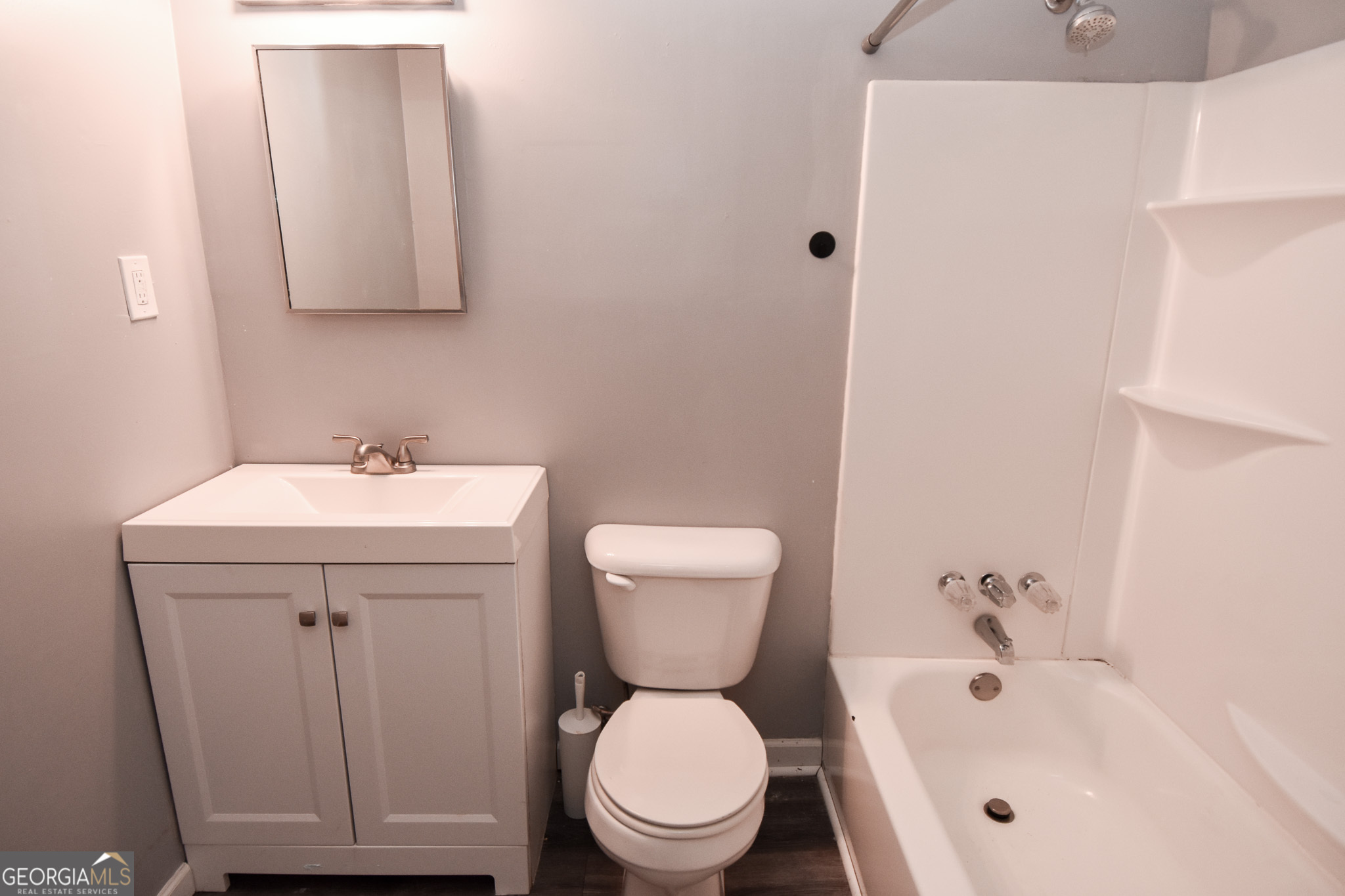 2250 Green Street Concord, GA 30206 - Photo 23 of 77 a bathroom with a sink a toilet and a mirror