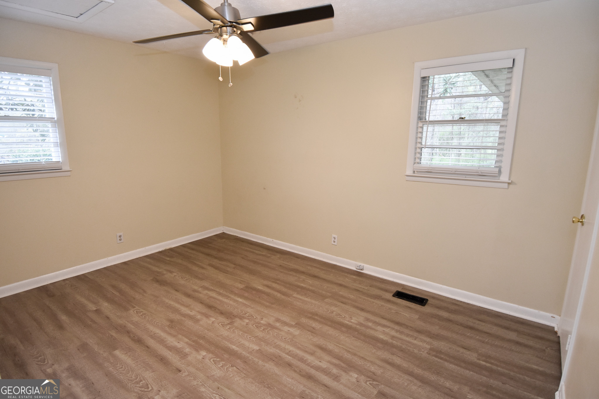 2250 Green Street Concord, GA 30206 - Photo 27 of 77 an empty room with a window and a fan