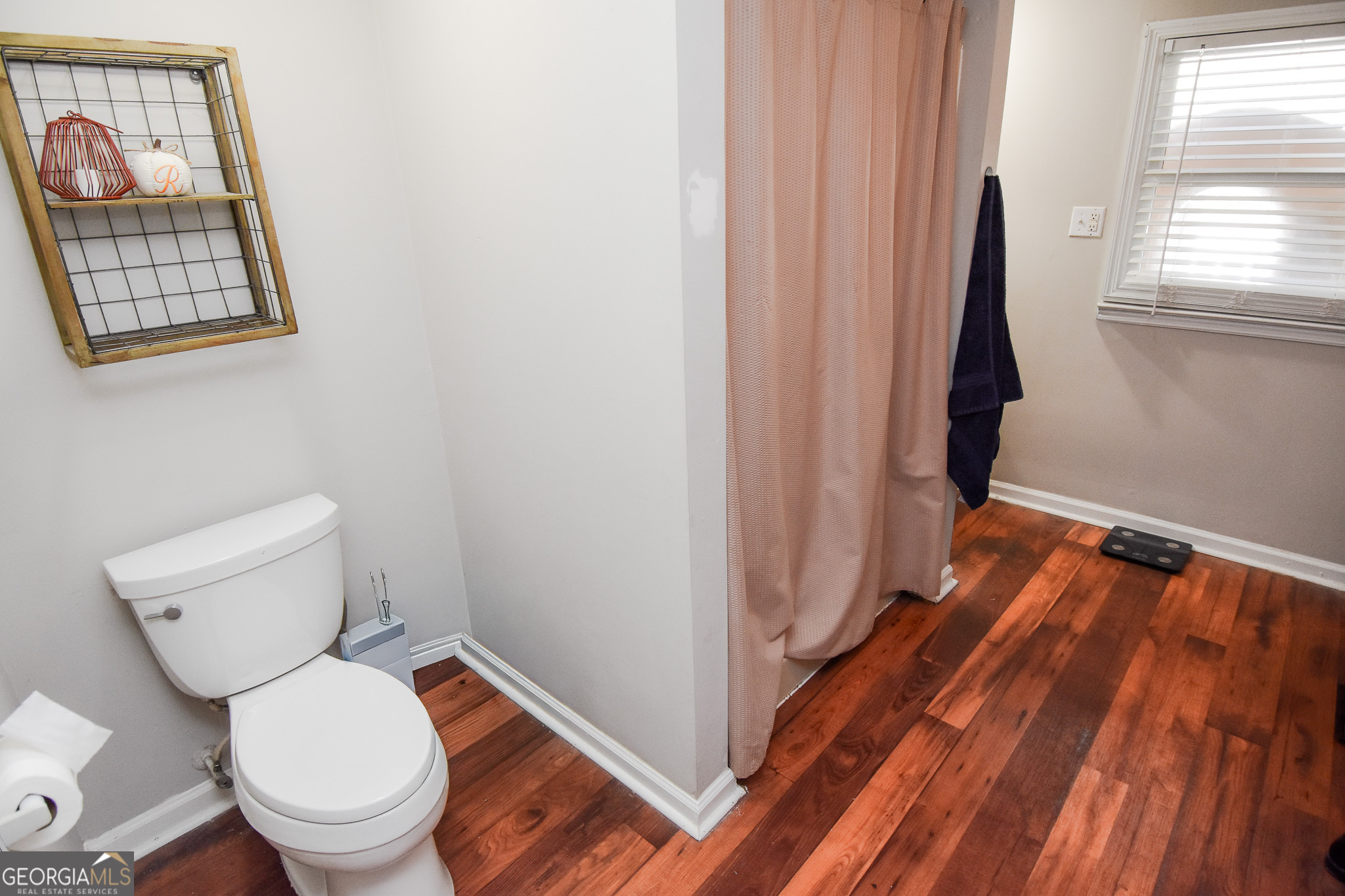 2250 Green Street Concord, GA 30206 - Photo 30 of 77 a white toilet sitting next to a small window