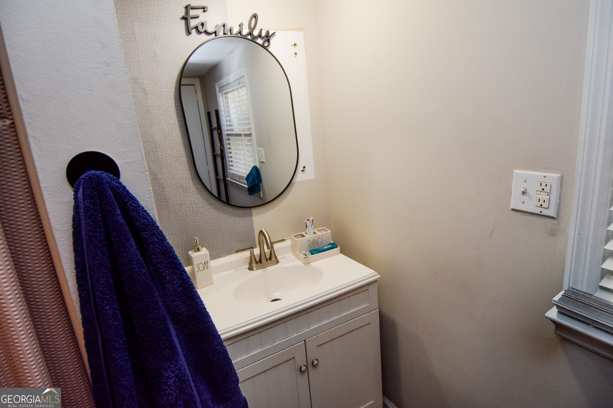 2250 Green Street Concord, GA 30206 - Photo 32 of 77 a bathroom with a sink and a mirror