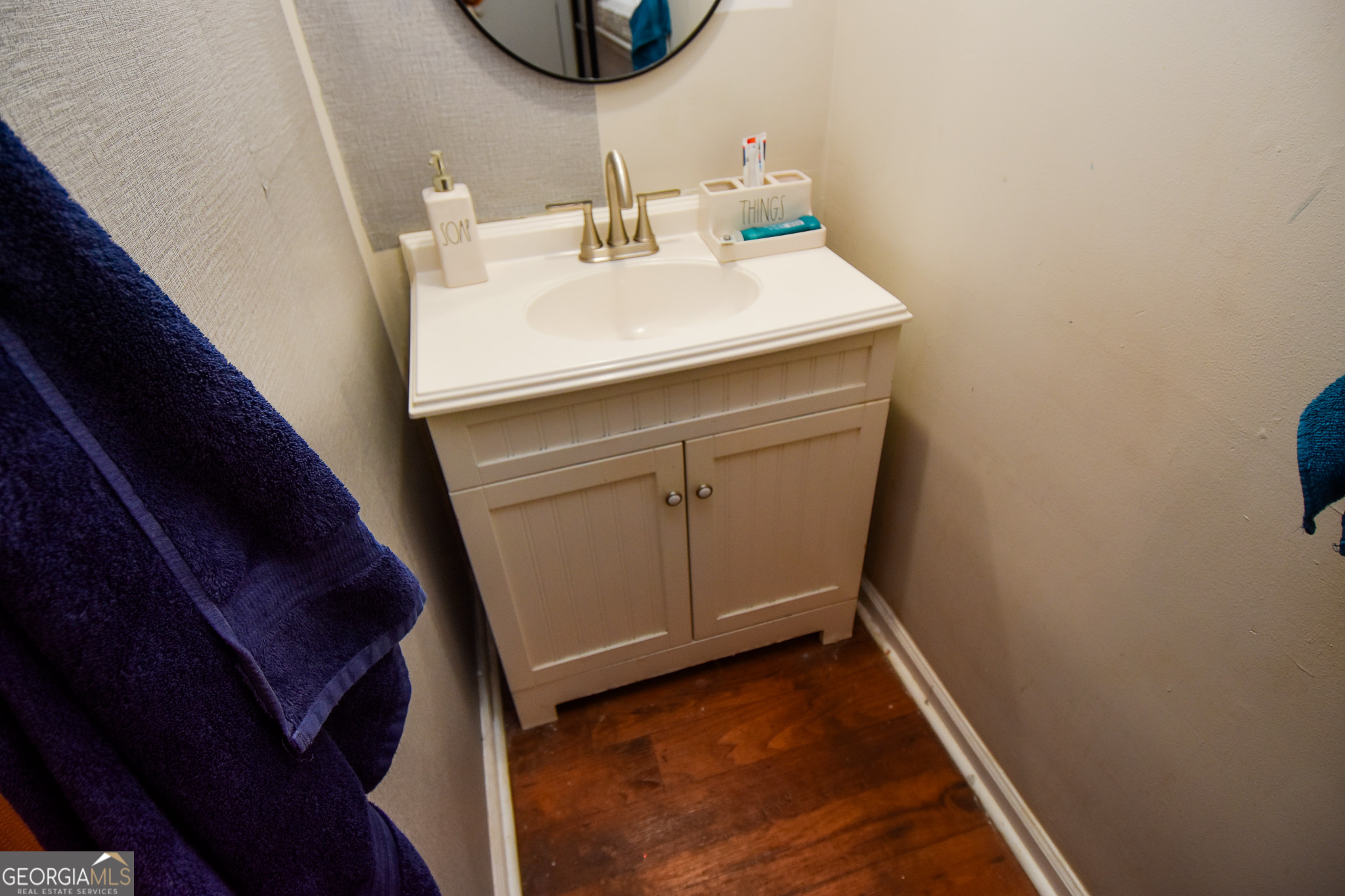 2250 Green Street Concord, GA 30206 - Photo 34 of 77 a bathroom with a sink and a mirror